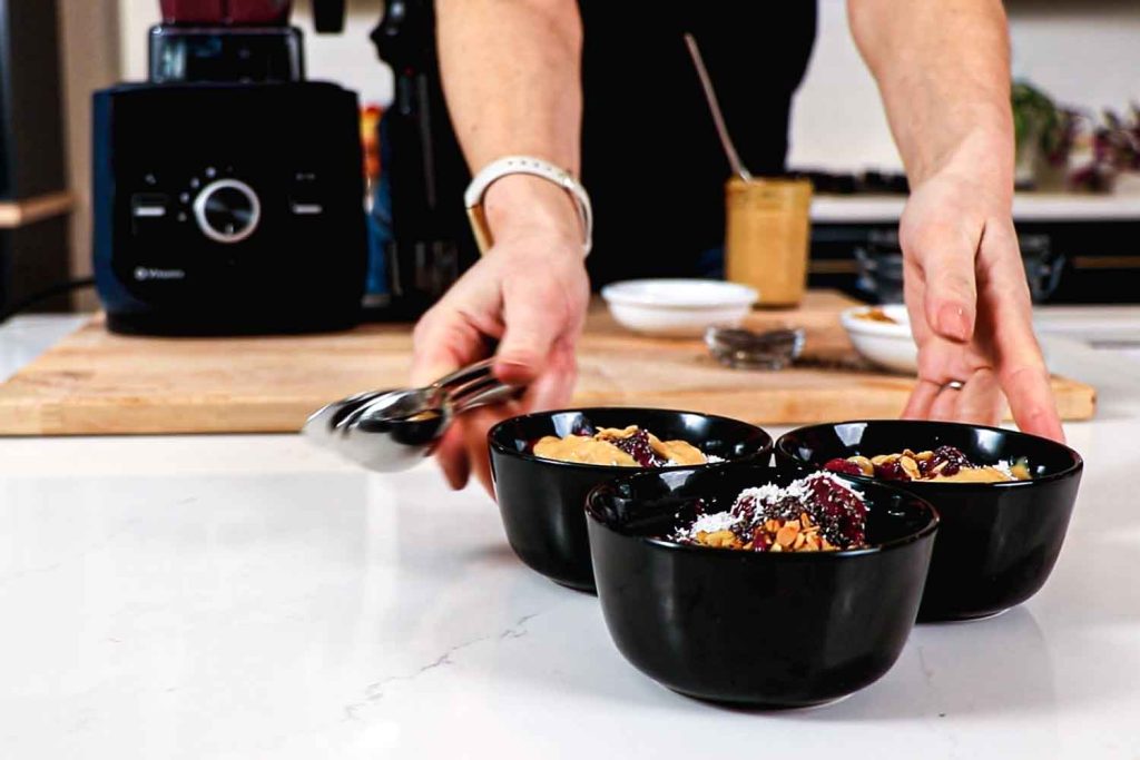 Serving three smoothie bowls made in Ascent X2.
