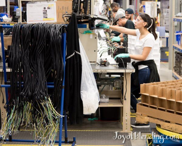 Rack of Vitamix cords and view down the production line