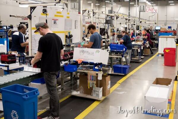 Quality control station with a view down the Vitamix production line