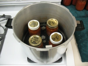 Jars of soup in pressure canner