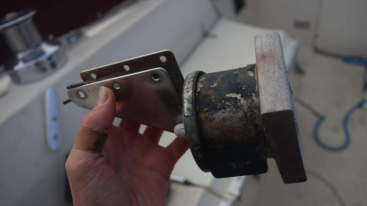 a light with a makeshift wooden cover and ss base