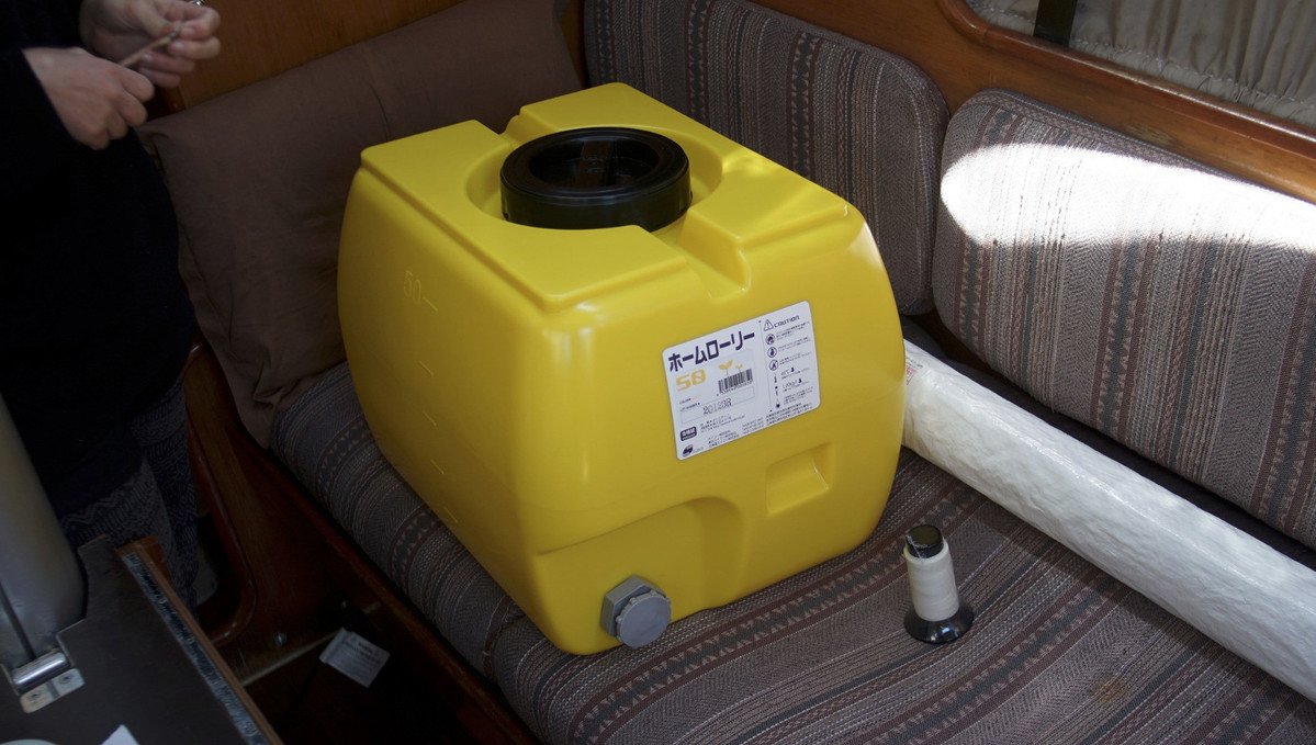 a photo of a lory tank on the berth of a sailboat