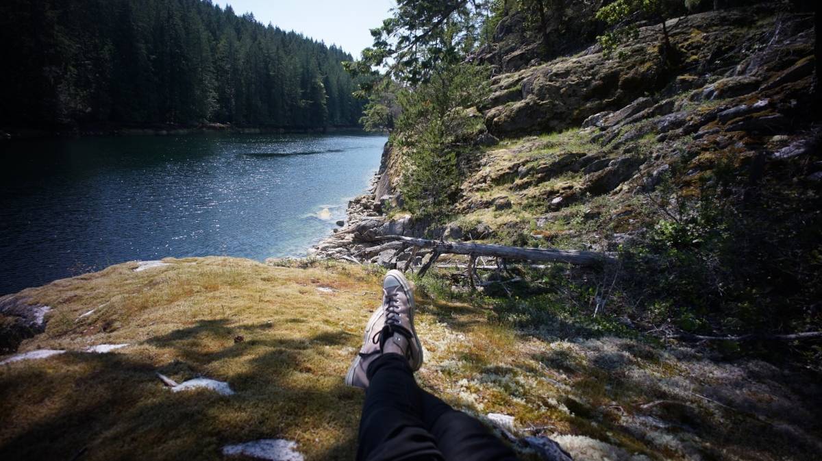 pov of devine sitting on shore on a sunny day