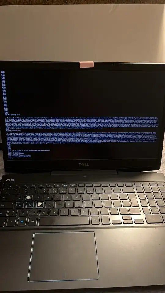 photo of a laptop screen; black screen with white text that is blurry and not legible or barely legible