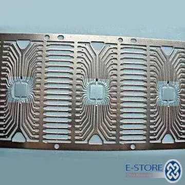 Three DIP-36 lead frames, still joined from the factory