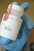 Drug test bottle with authentication seal