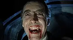 Film still of Christopher Lee wearing red contact lenses