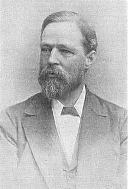 Bell, sitting in three-quarter pose