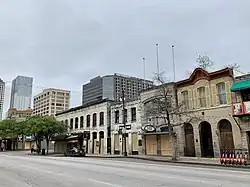 Businesses with boarded windows and entrances