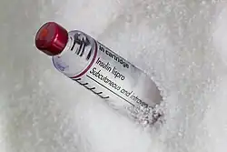 vial of Humalog insulin buried in sugar