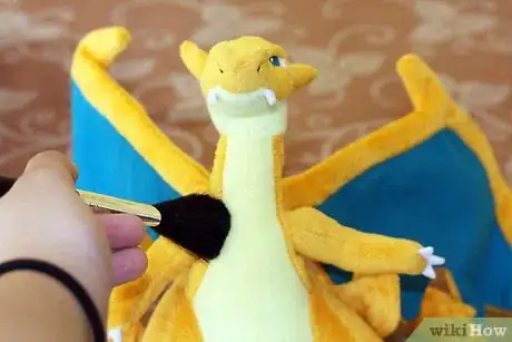 Image titled Take Care of a Pokemon Figure Step 2