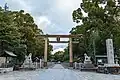 A torii gate at the entrance of a shrine