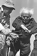 David Ben-Gurion building a security fence in Mivtahim in 1956