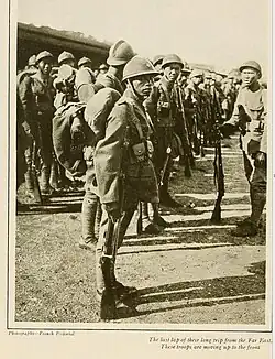 Old newspaper clipping of Asian soldiers