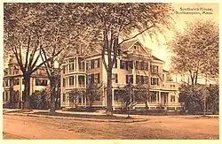 41 Elm Street, Northampton, MA. 1900 photo shows addition of Victorian-era porches. Originally built c.&nbsp;1810. Federal style.[9]