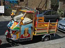 A Piaggio Ape painted in the carretto style