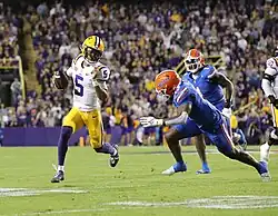 Jayden Daniels running with the football with the LSU Tigers against the Florida Gators