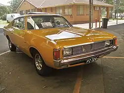 Chrysler VH Valiant Charger XL coupe. Note amber turn signals with park lights below bumper as required by Australian regulations for 1973