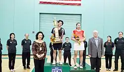 Tai Tzu-ying holds the trophy in the podium of the 2011 U.S. Open