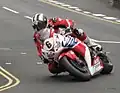 2013 Isle of Man TT Superbike Race Lap 6 – Michael Dunlop (6) 1000cc Honda Parliament Square, Ramsey 2 June 2013.