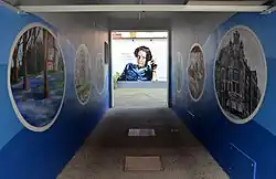 Photograph of the courtyard of the house in which she was born, showing Hannah with a cigarette in her hand and the inscription, attributed to her "No one has the right to obey", in German