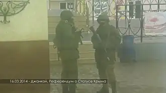 Colored dice with checkered background