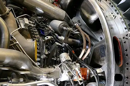 General Electric GE90 shows one of two locations (45 degrees either side of top centre) on fan frame where engine thrust is transferred by links to the rear thrust mount for transfer to the aircraft pylon.[136]