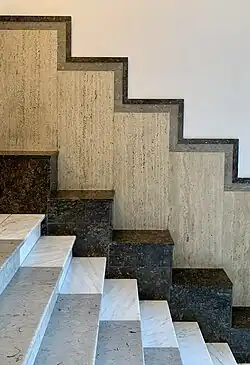 Art Deco – Marble facing in the entrance hall of Strada Pitar Moș no. 27–29, Bucharest, by Sandy Herivan, 1931–1933[74]