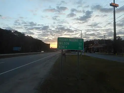 Southbound NC&nbsp;4 near Rocky Mount, where the destination sign still shows Wilson and Kenly.