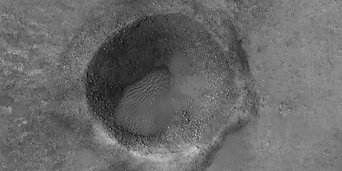 Close view of boulders near mud volcanoes, as seen by HiRISE under HiWish program. The boulders may be from an upper layer. Mud from a mud volcano does not contain boulders, only fine-grain material.
