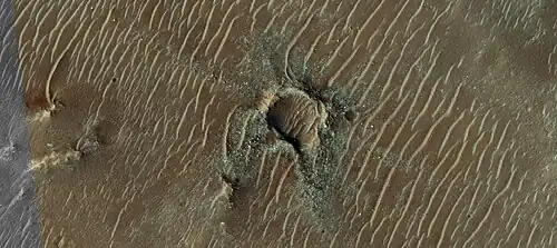Crater with colorful ejecta, as seen by HiRISE under the HiWish program The ejecta represents samples of material from underground. Craters allow us to study underlying material.
