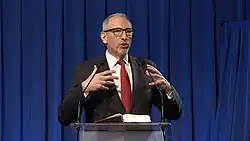 View of Podkowa Leśna speaking at a podium in Podkowa Leśna