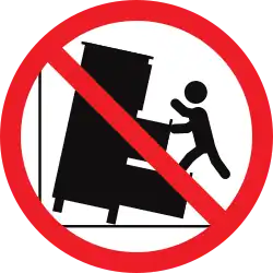 Icon of a tall chest of drawers falling on top of a child, with a red "do not" symbol over it