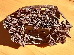 A handmade Javanese batik cap for stamping patterns, made of copper strips and wires