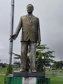 Bronze statue of Sam Mbakwe in a suit
