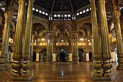 A very well lit Durbar Hall (ceremonial meeting hall of the royal court) of Mysore Palace during the day