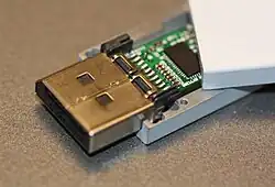 Open active DisplayPort cable, revealing the equalizer chip