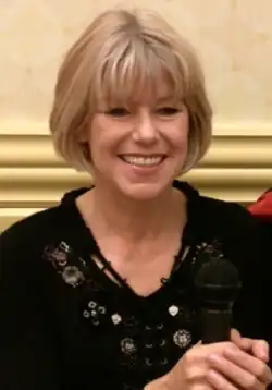 Adrienne King, smiling.
