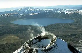 The lake-filled Akademia Nauk caldera, seen from the north with Karymsky volcano in the foreground