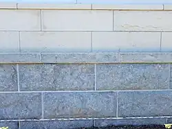 Americus Limestone: Grey contrasting with the buff Cottonwood Limestone.