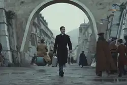 Syril walks down a street in Ghorman on his way to work