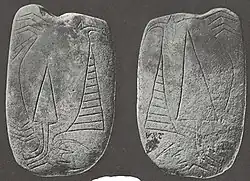 Celt shaped decorated pipe