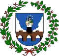 A coat of arms depicting a brown bridge rising up out of a blue body of water into a blue sky with white clouds