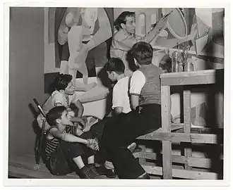 Artist Philip Guston working on a mural in 1940.