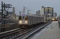 Purple Line Express train running along a former embankment track, viewed from Argyle station.