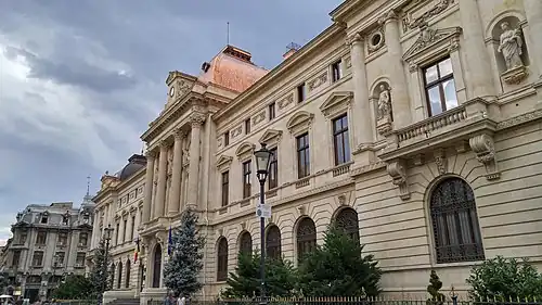 Beaux-Arts aka Eclectic - Exterior of the Old National Bank of Romania Palace, Bucharest, 1883–1900, by Joseph-Marie Cassien Barnard and Albert Galleron, assisted by Grigore Cerkez and Constantin Băicoianu[38]