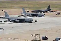 Three Boeing B-52H Stratofortress bombers sit on the flight-line at Barksdale Air Force Base in 2012.