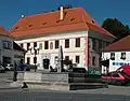 Town square with the manor house and fountain