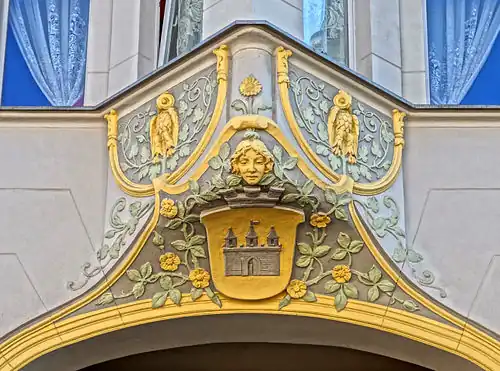 Bay window ornament with a woman head and Bydgoszcz coat of arms