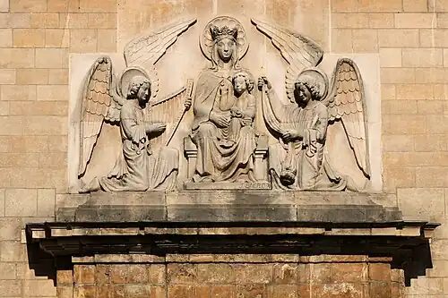 Bas-relief above the portal: Madonna and Child (Sedes Sapientiae)